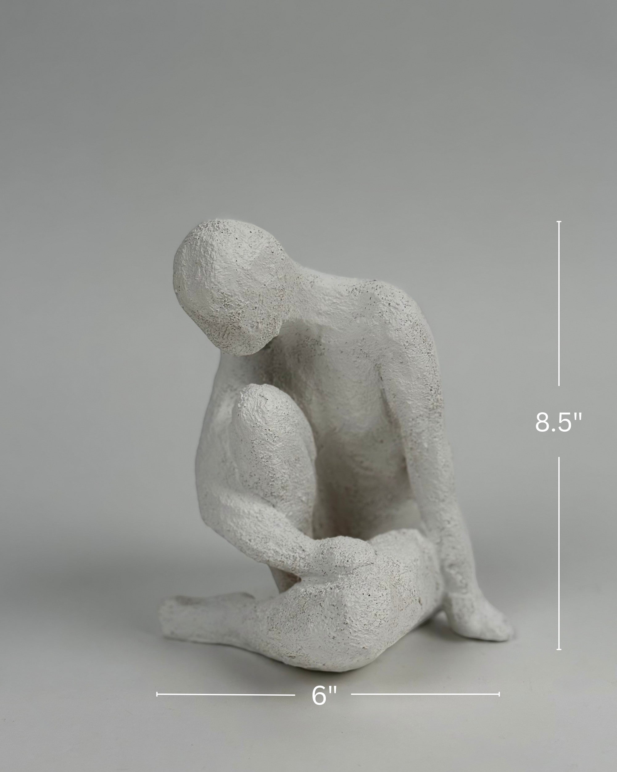 High Objects textured white polyresin abstract faceless figure sculpture, 8.5 inches tall, in a contemplative pose.
