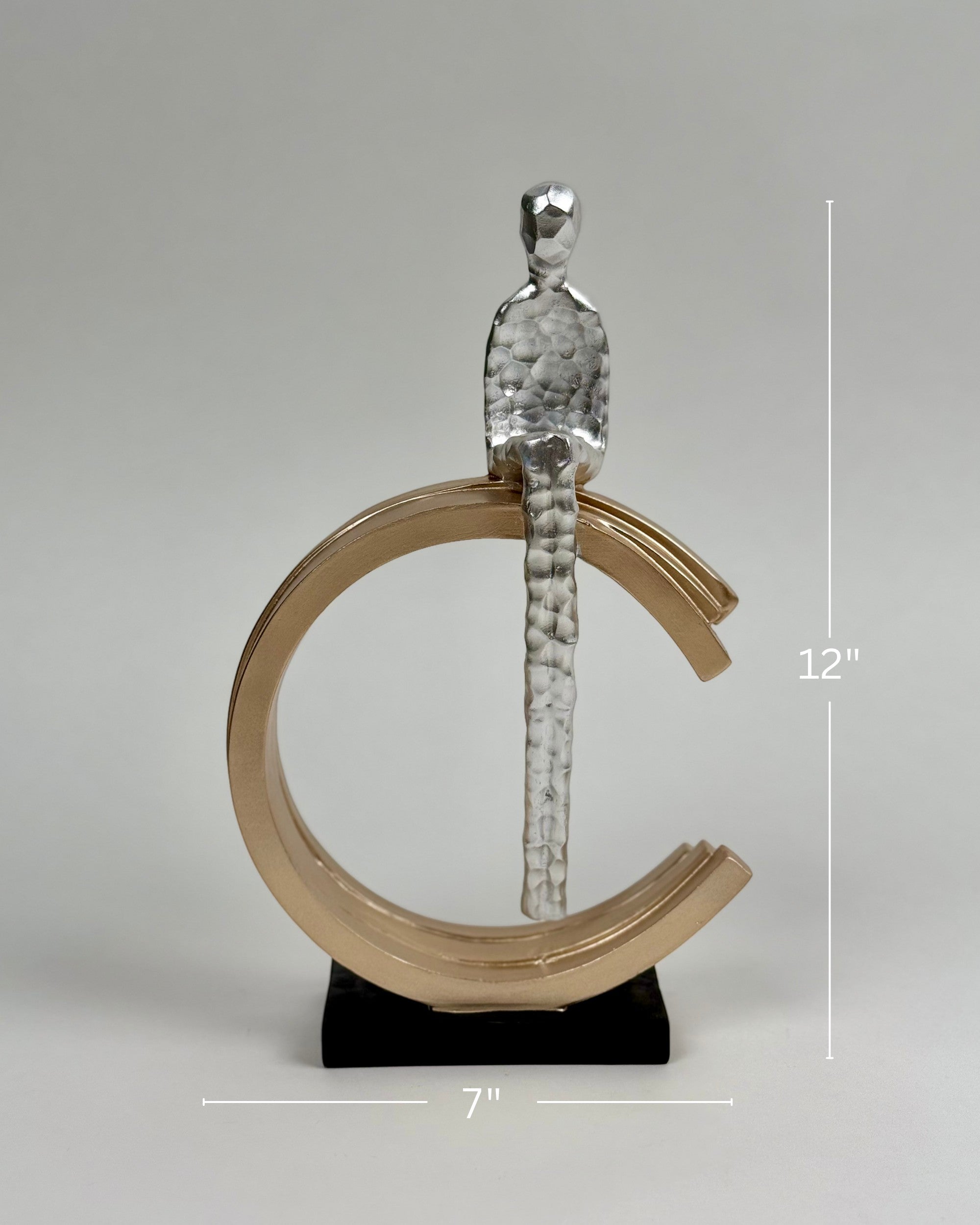 High Objects Arc of Solitude showpiece: metallic figure seated on gold arc, black base. Modern polyresin decor.