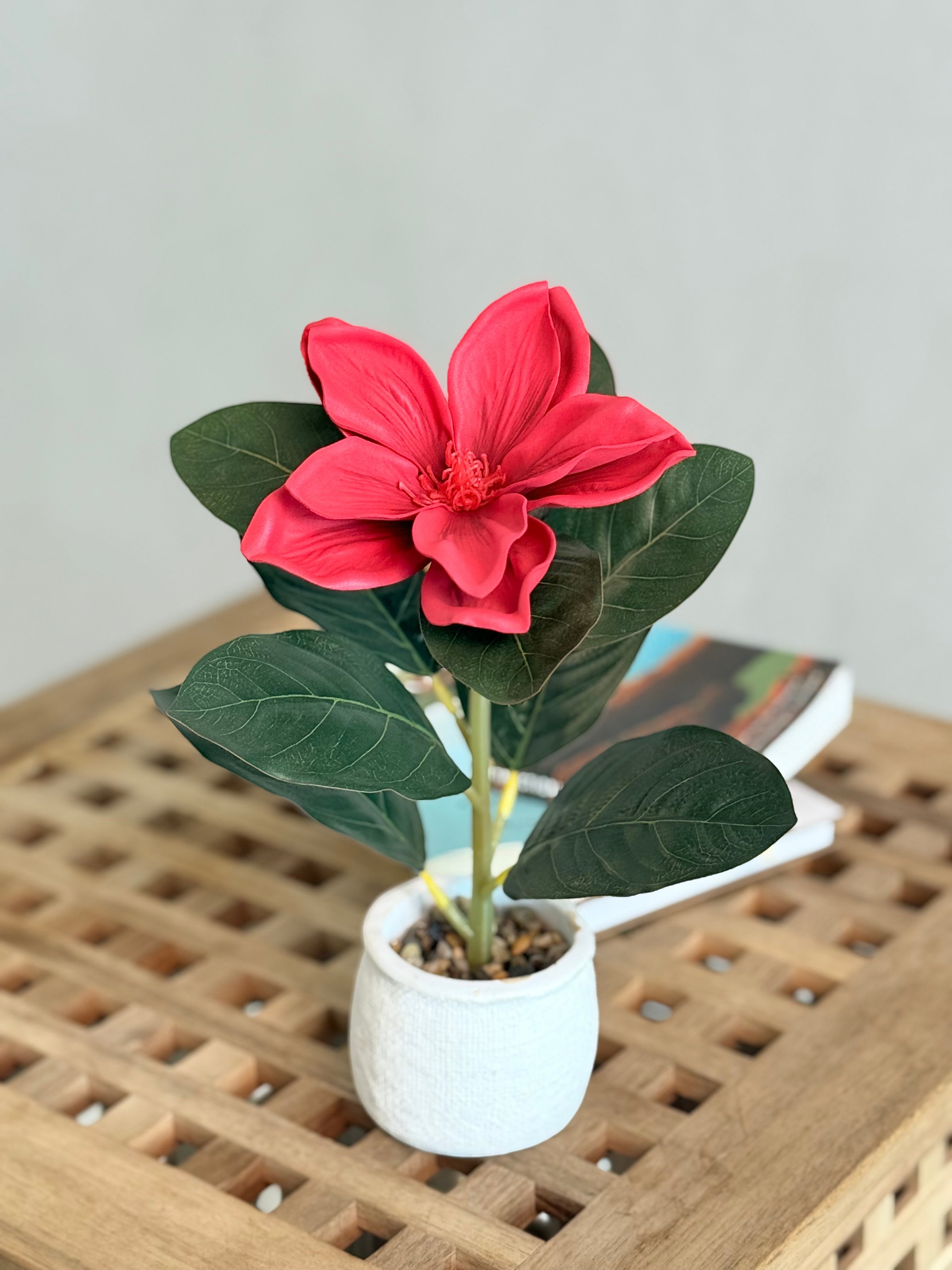 High Objects artificial red lily plant with lush green leaves in a white ceramic pot with pebbles.