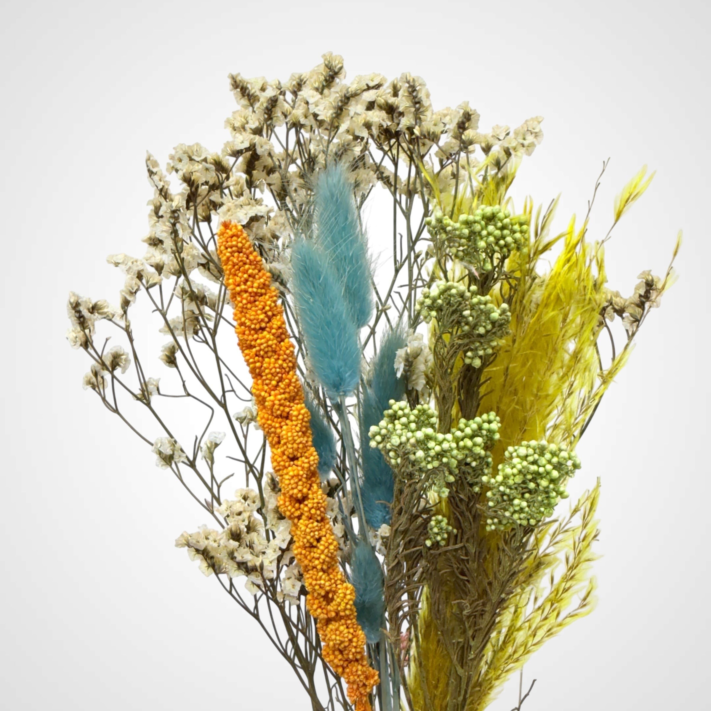 High Objects Botanical Sunlit Meadow dried flower arrangement with yellow, teal, orange, and cream blooms and grasses.