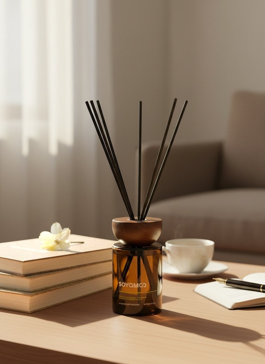 High Objects compact brown glass reed diffuser with oriental wood scent, 110ml capacity, on a table with books and a coffee cup.
