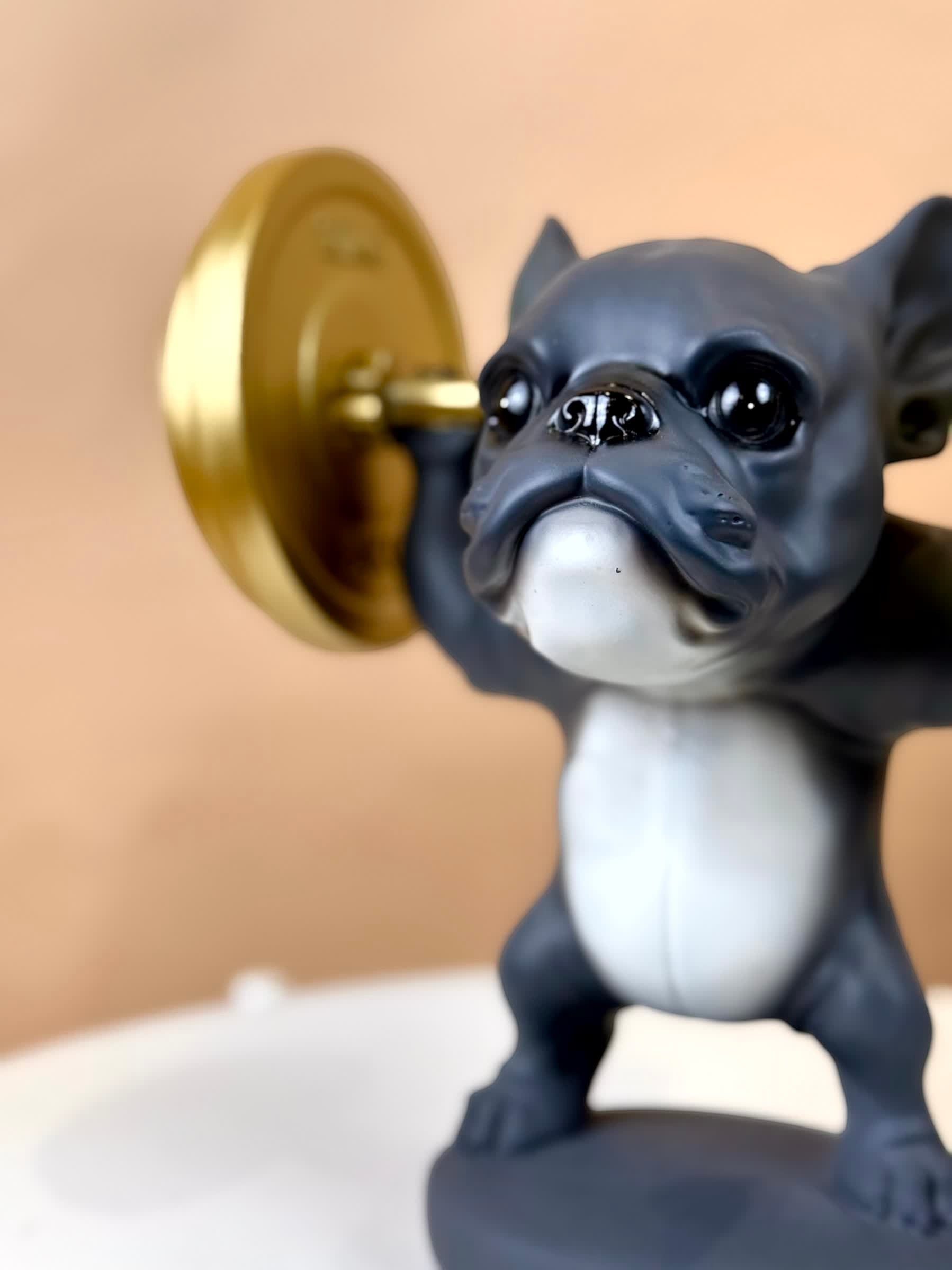 High Objects matte black bulldog figurine lifting a gold barbell, polyresin, modern décor
