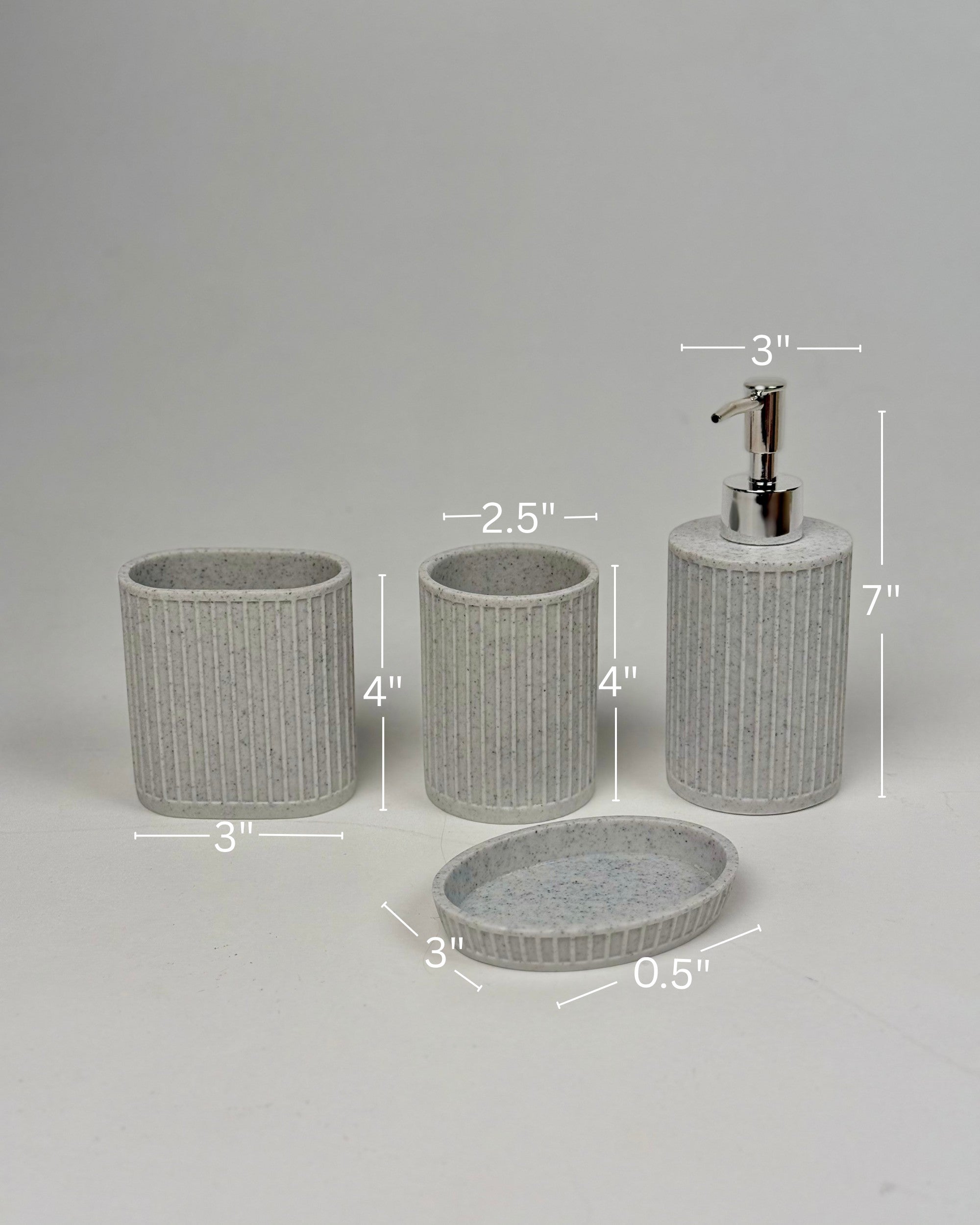 High Objects Calmridge Bathroom Accessory Set: speckled grey resin soap dispenser, toothbrush holder, tumbler, and soap dish with ribbed texture.