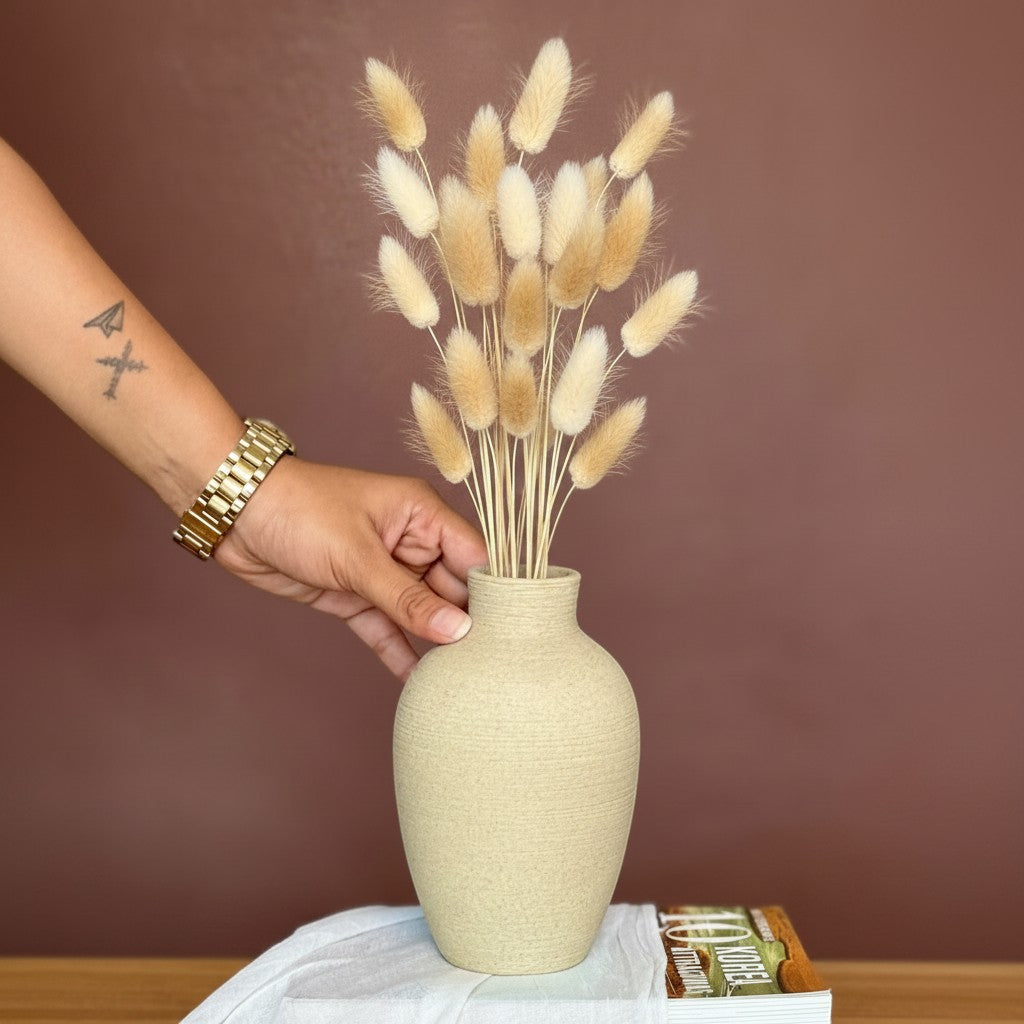 High Objects ClayHaven Vase, a textured matte beige ceramic vase holding dried bunny tail grass in green and tan.