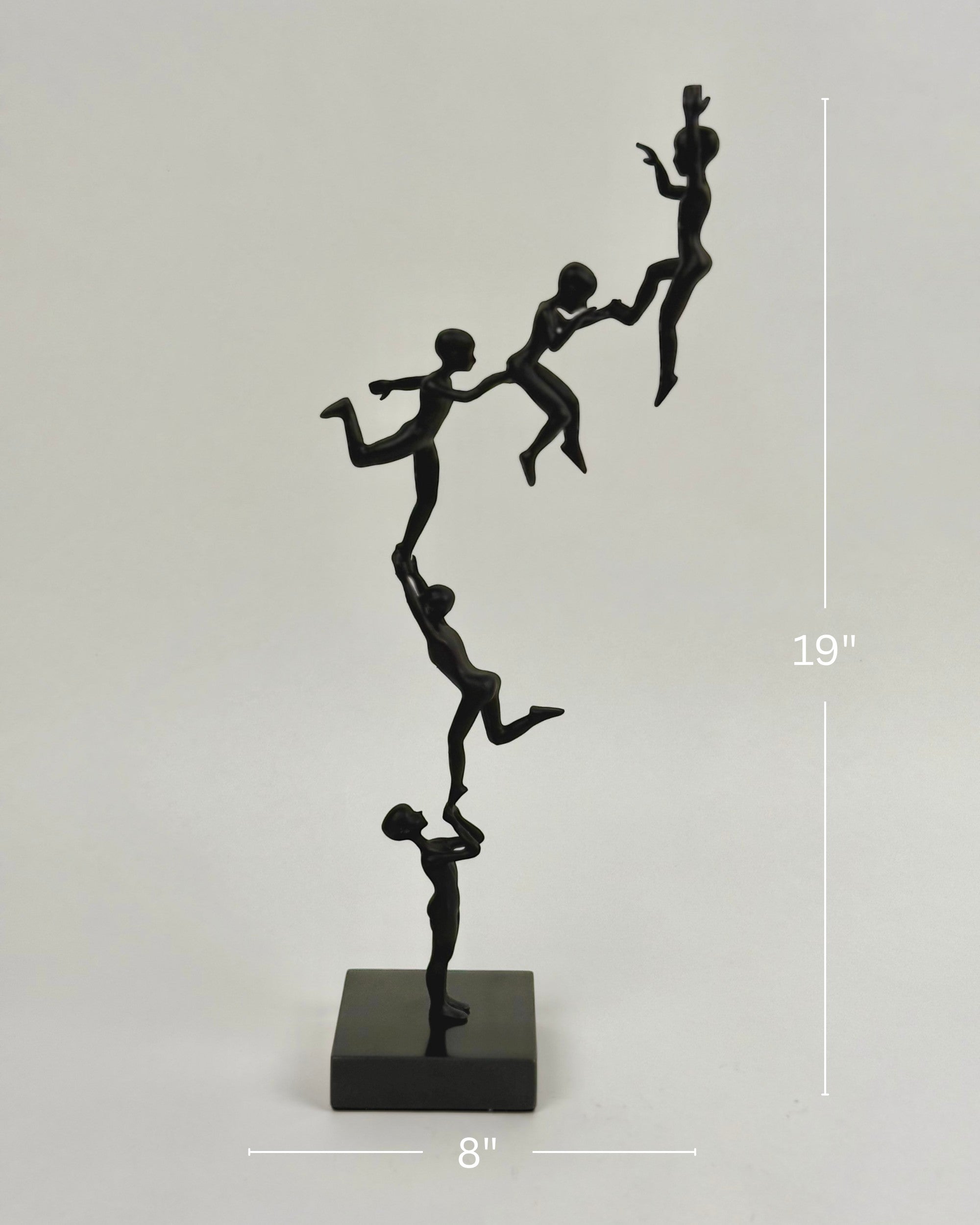 High Objects Climber Crew Artefact sculpture, matte black finish, 19 inches tall, depicting figures in a chain lifting each other.