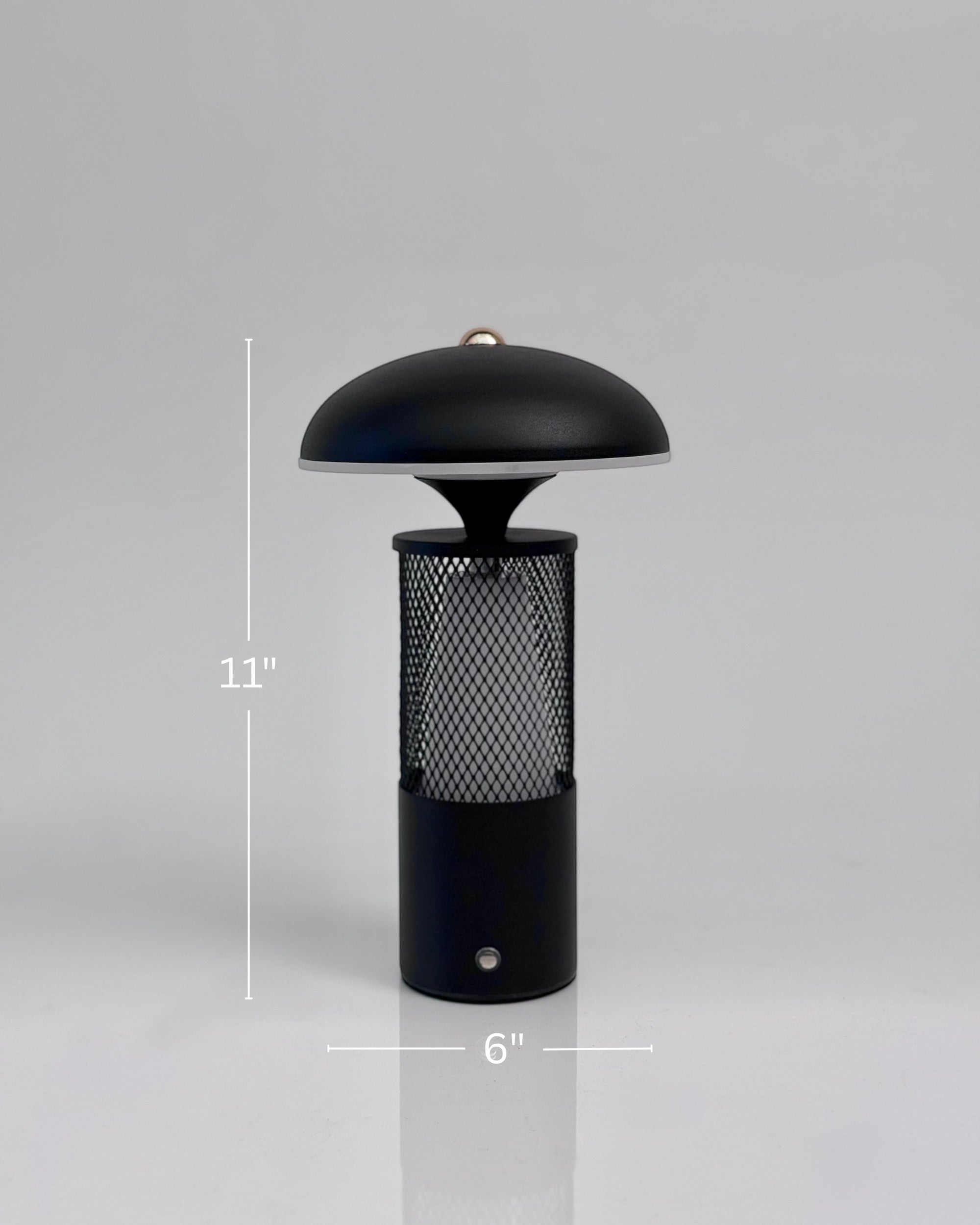 High Objects Eclipse Mesh Table Lamp in matte black with gold detailing, mushroom silhouette, textured mesh body, 11" H x 6" W.