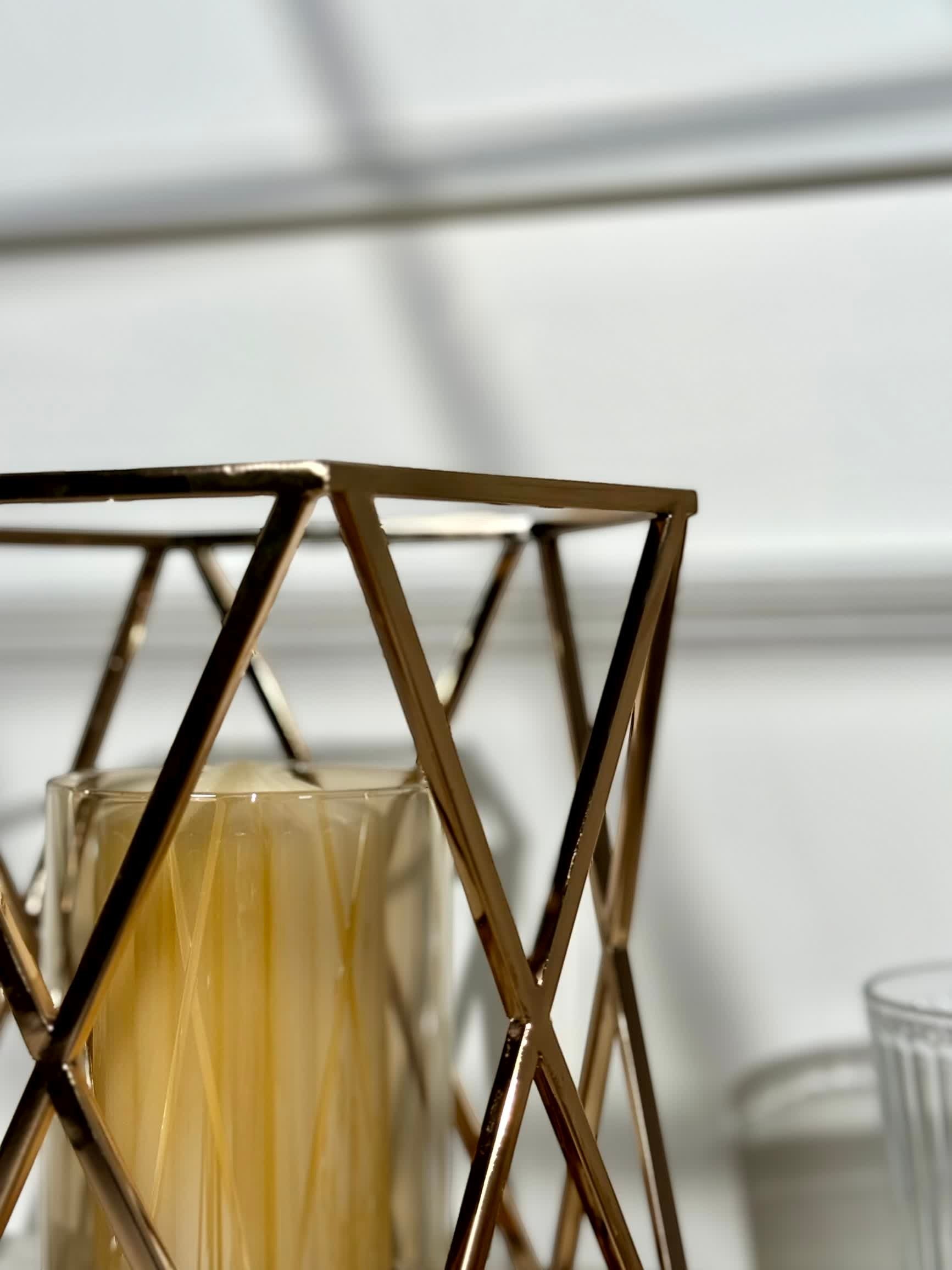 High Objects Gilded Prism Candle Stand with gold geometric frame and textured glass holder, modern decor.