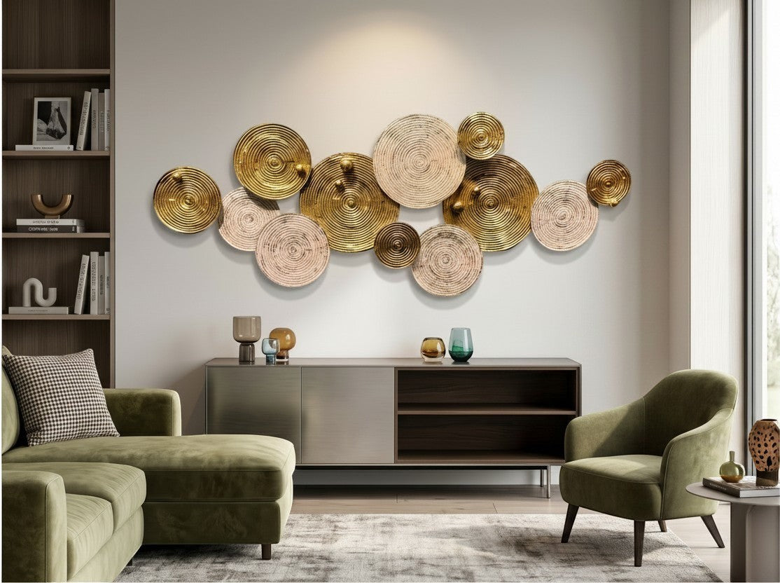 High Objects decorative wall art featuring overlapping gold metal and textured beige circular discs in a living room.