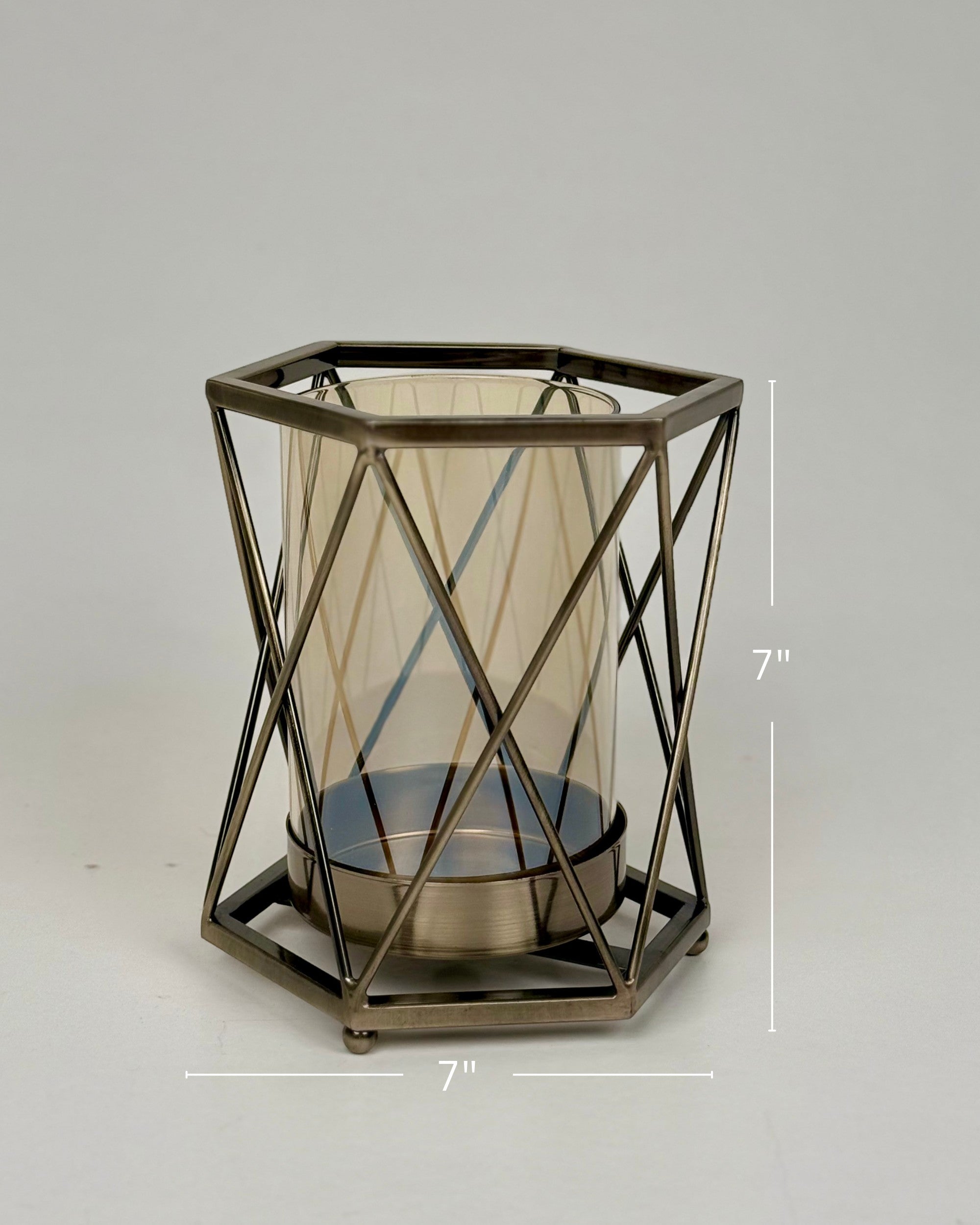 High Objects Hexagrid candle stand with geometric metal frame and amber glass cylinder. Modern decor.