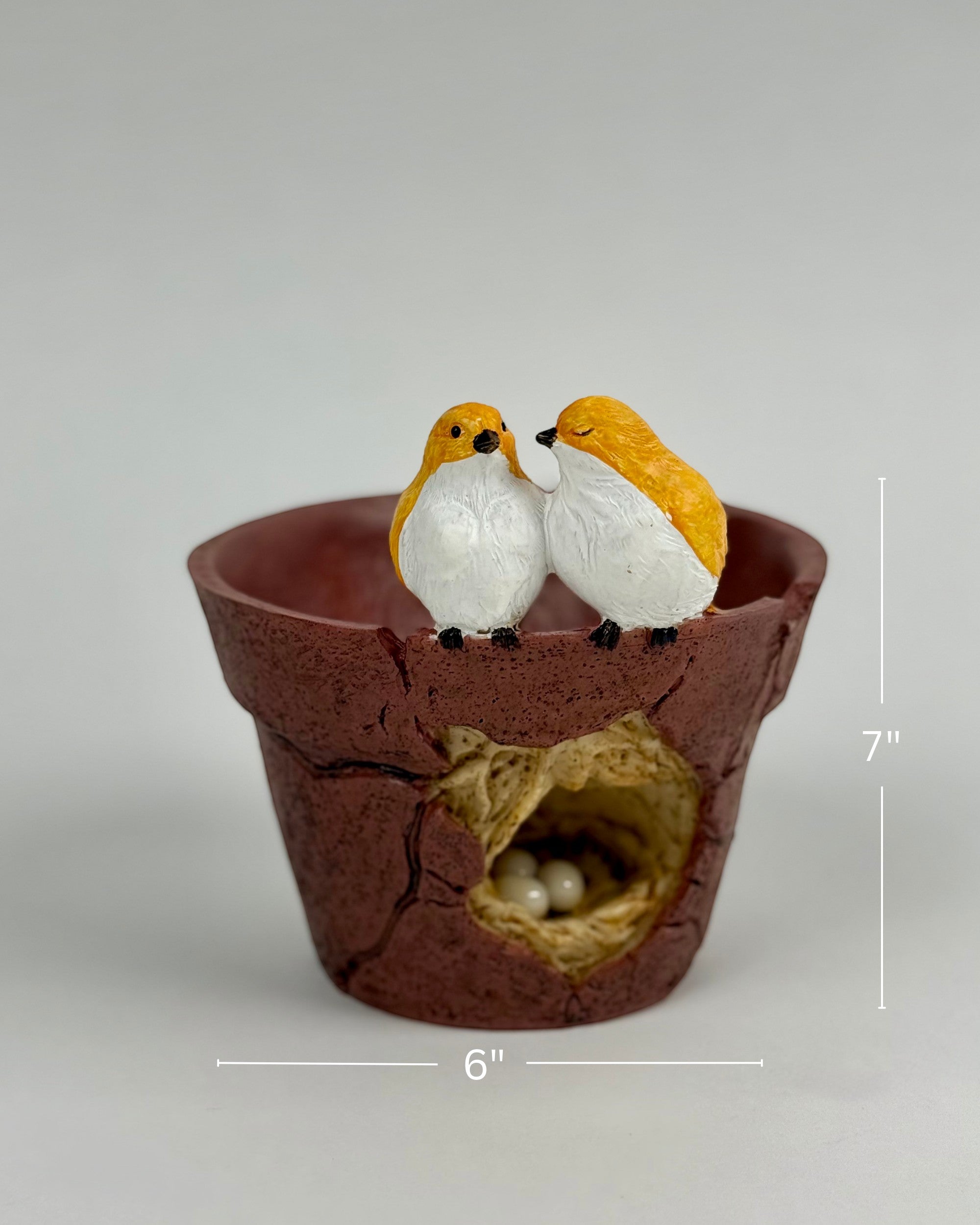 High Objects Lovebird Planter Showpiece, rustic brown polyresin pot with cracked design, featuring two yellow and white lovebirds on the rim and a nest with eggs inside.