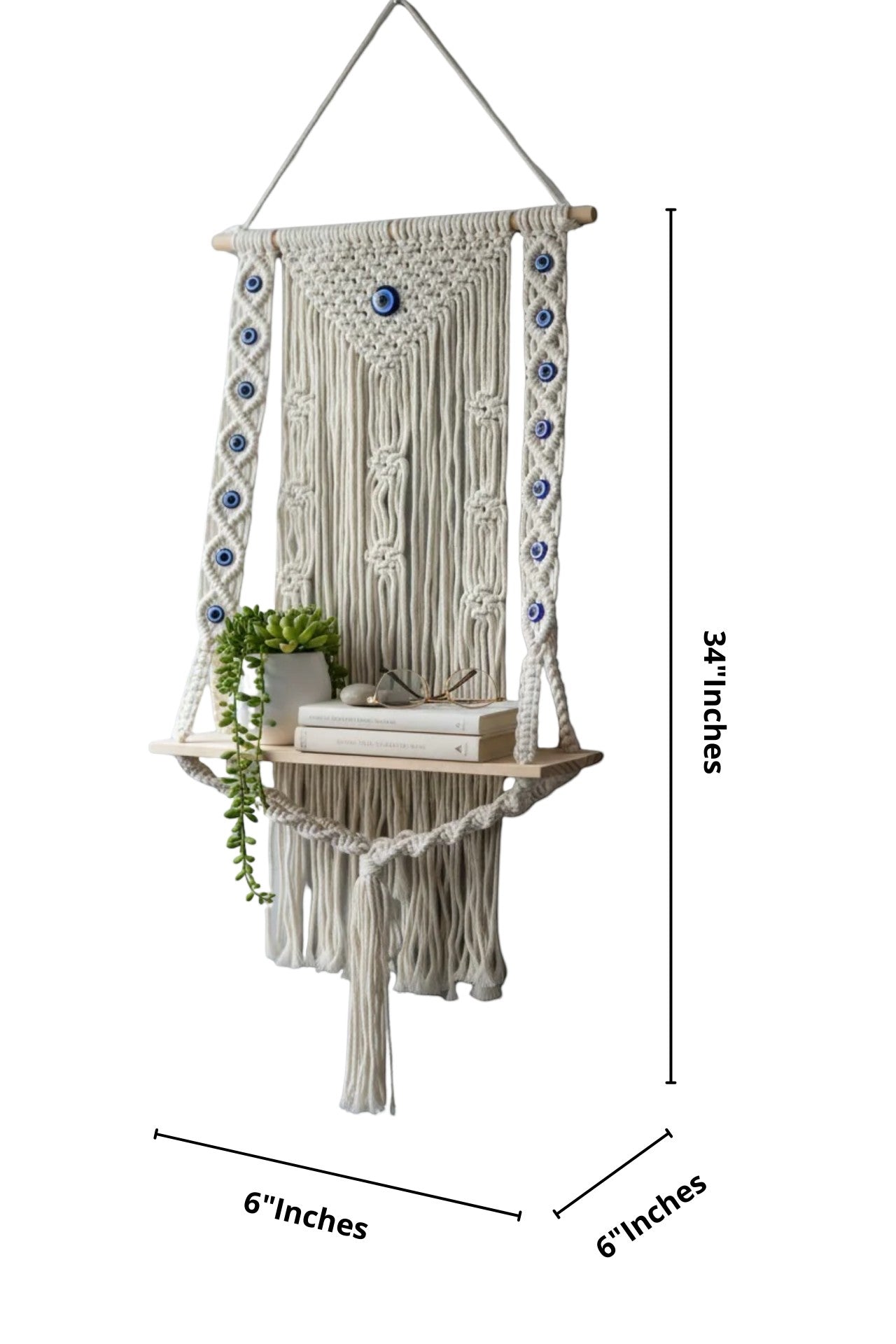 High Objects NazarGuard Boho Macrame Shelf with blue evil eye details, handmade cotton rope and wooden shelf holding books and a plant.