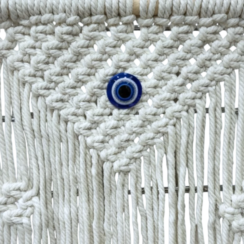 High Objects NazarGuard Boho Macrame Shelf with white cotton ropes and blue evil eye detail. Handmade wall decor.