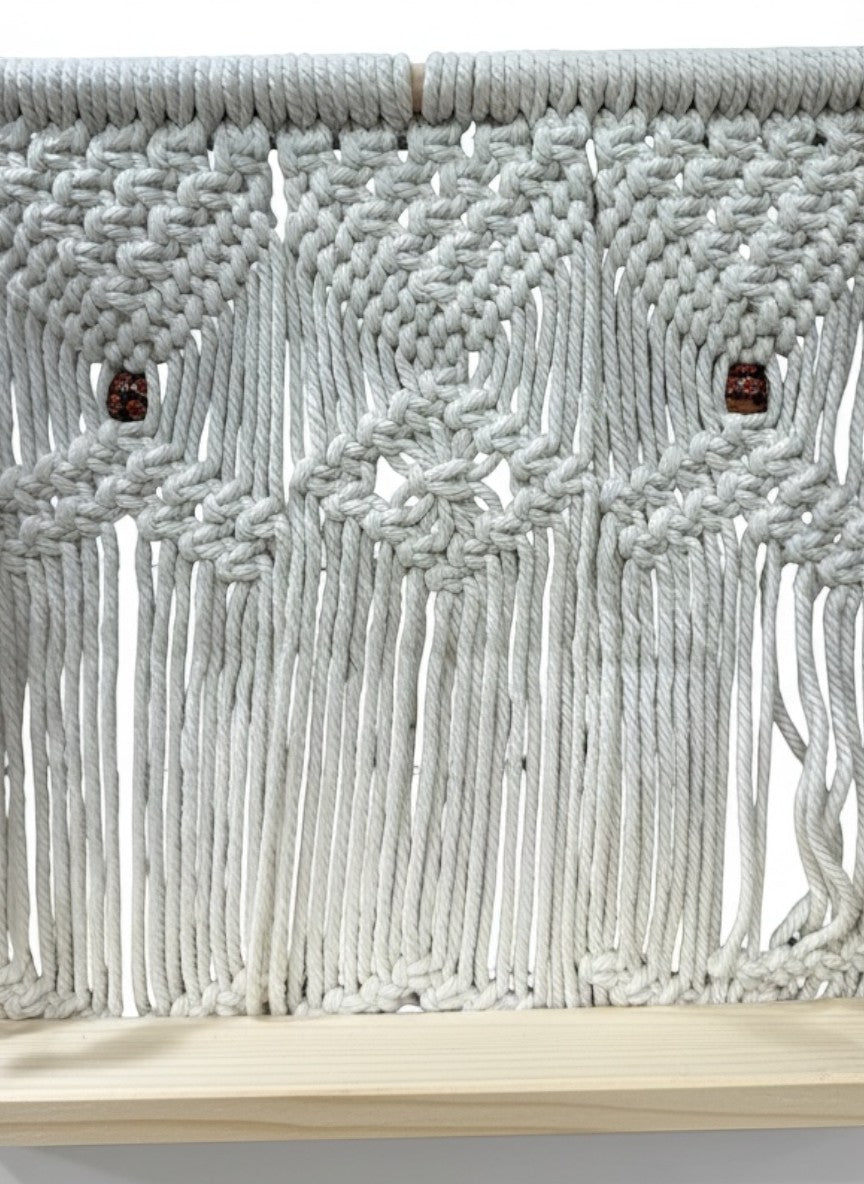 High Objects Ethereal Collection macrame wall shelf with wooden base, cream cotton rope, and decorative wooden beads.
