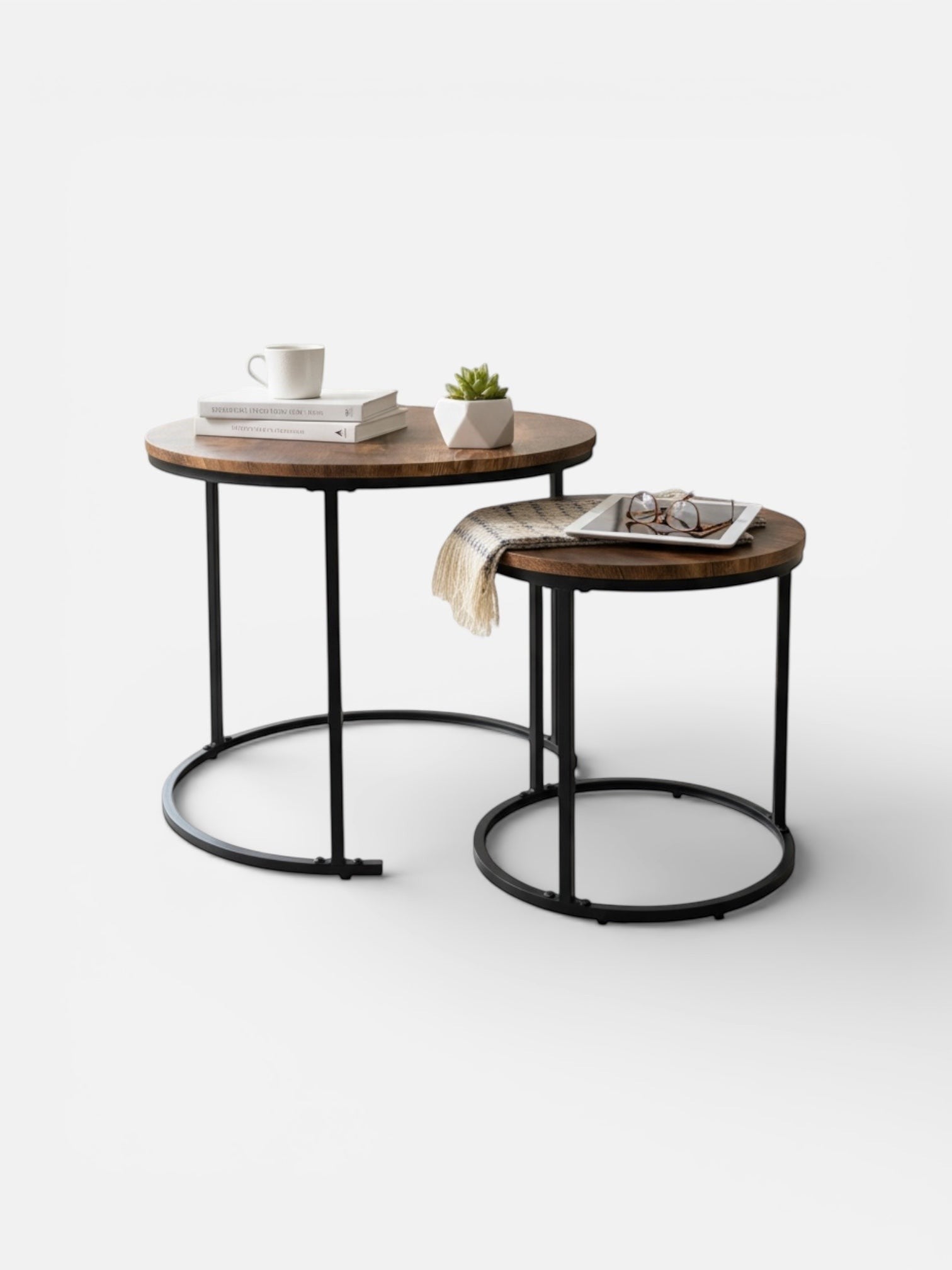 High Objects modern nesting coffee table set with round wooden tops and black metal frames. Includes two tables.