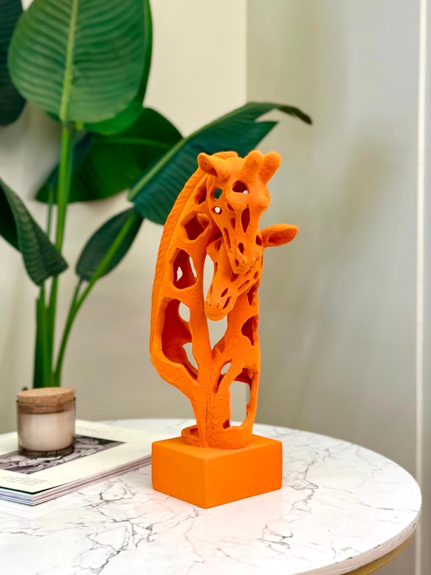 High Objects Savannah Embrace Showpiece, abstract matte terracotta-orange giraffe sculpture with cut-out design.