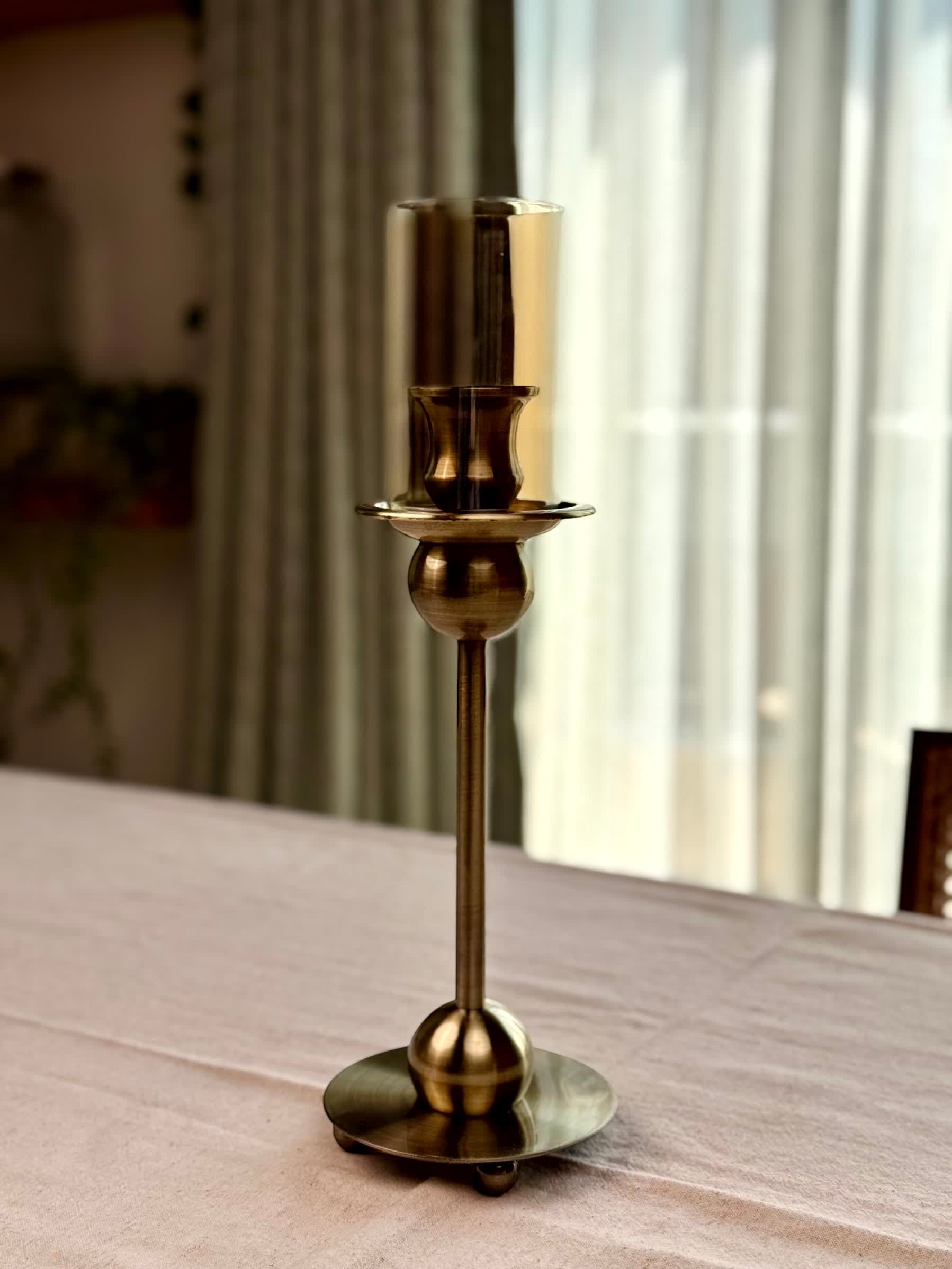High Objects Seren Column Candle Stand Set, antique brass metal with sphere detail and tinted glass hurricane cover.