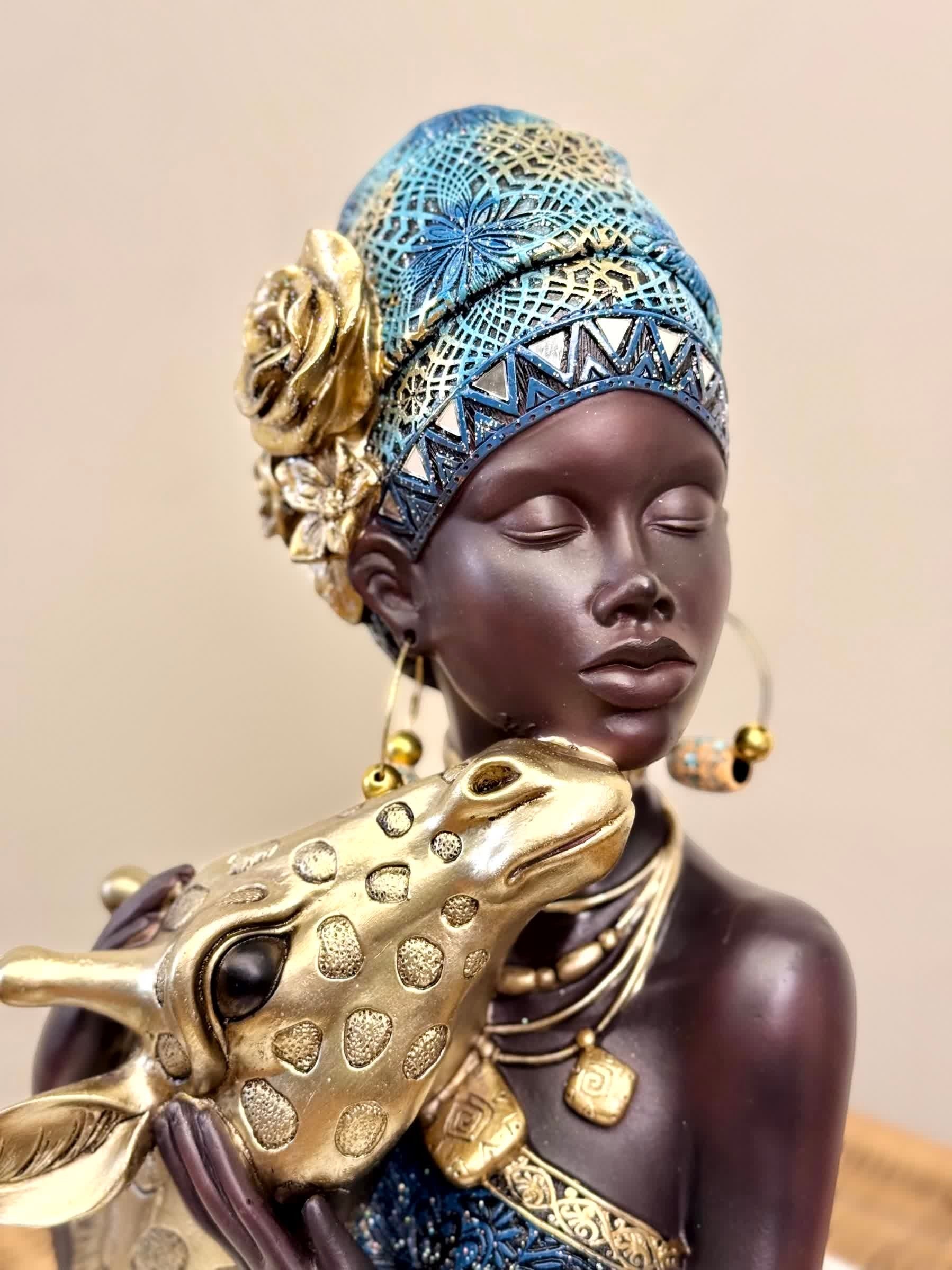 High Objects Serenity Bond Woman & Giraffe Showpiece sculpture with gold accents and blue headwrap.