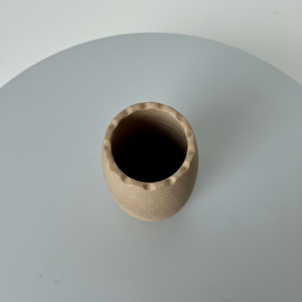 High Objects beige ceramic vase with wavy rim, 7" height, 3.5" diameter. Modern minimalist design.