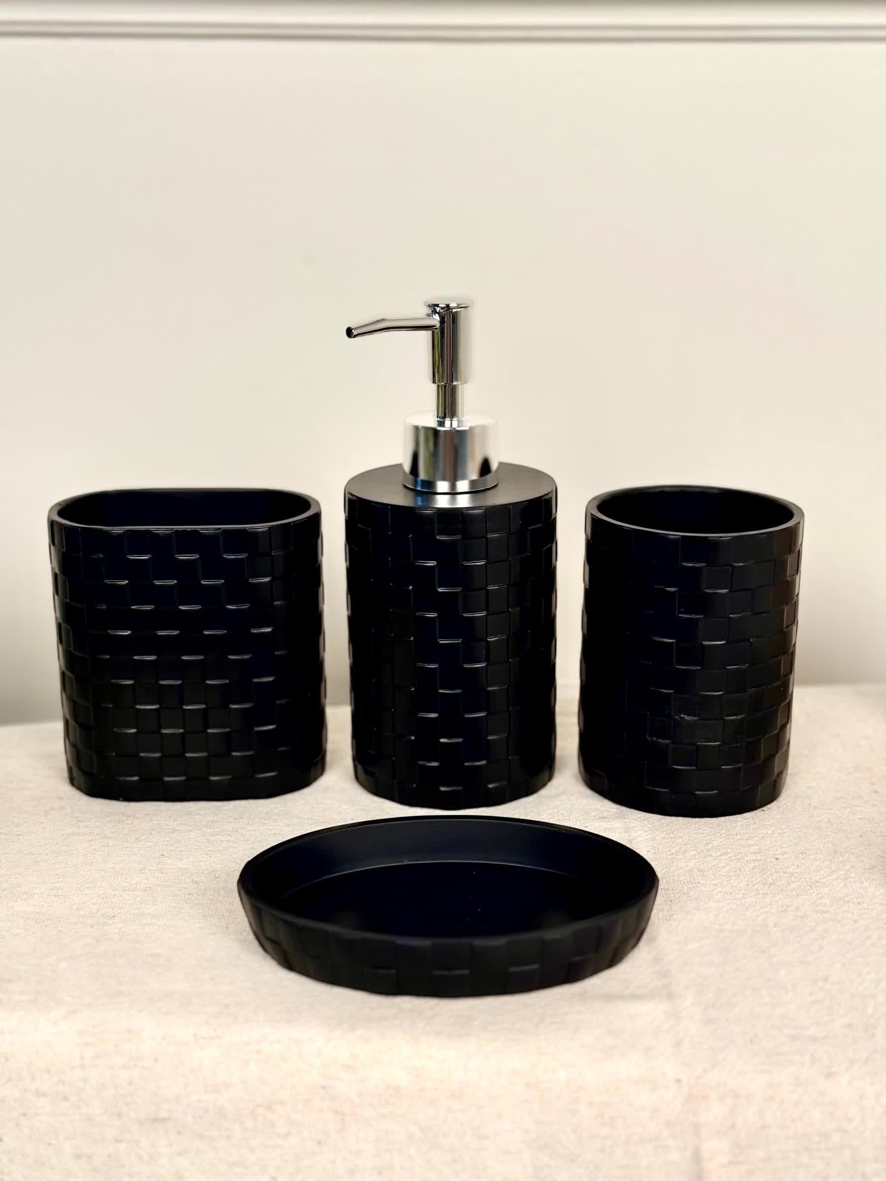 High Objects Weaveform black bathroom accessory set with woven texture, including soap dispenser, toothbrush holder, and tray.