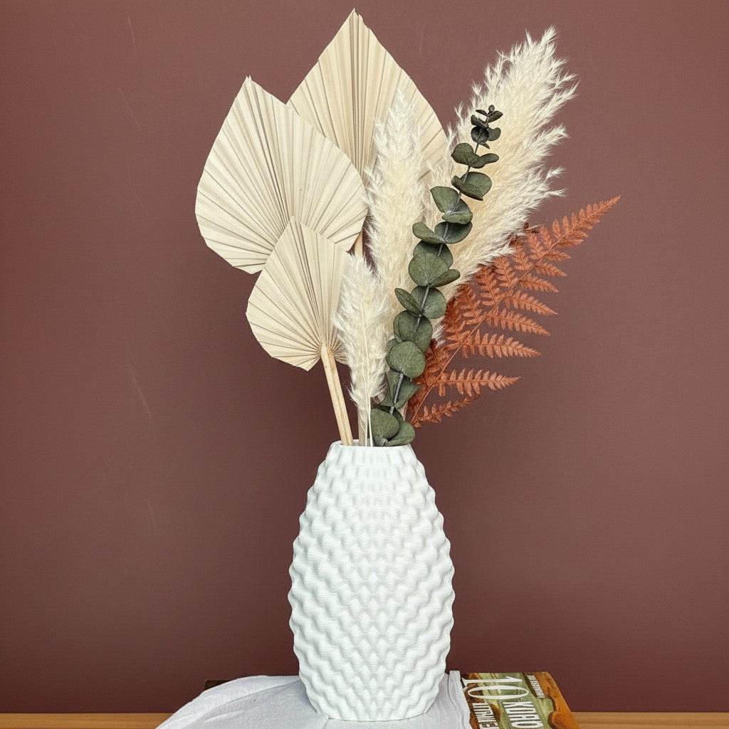 High Objects Arisca Vase, white ceramic with textured wave pattern, holding dried botanicals.