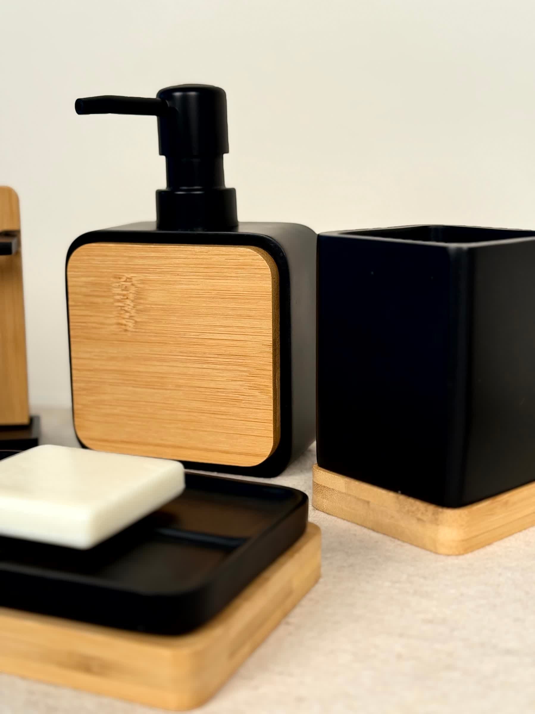 High Objects Zenform Bathroom Essentials Set: Black soap dispenser, toothbrush holder, and soap dish with bamboo accents.