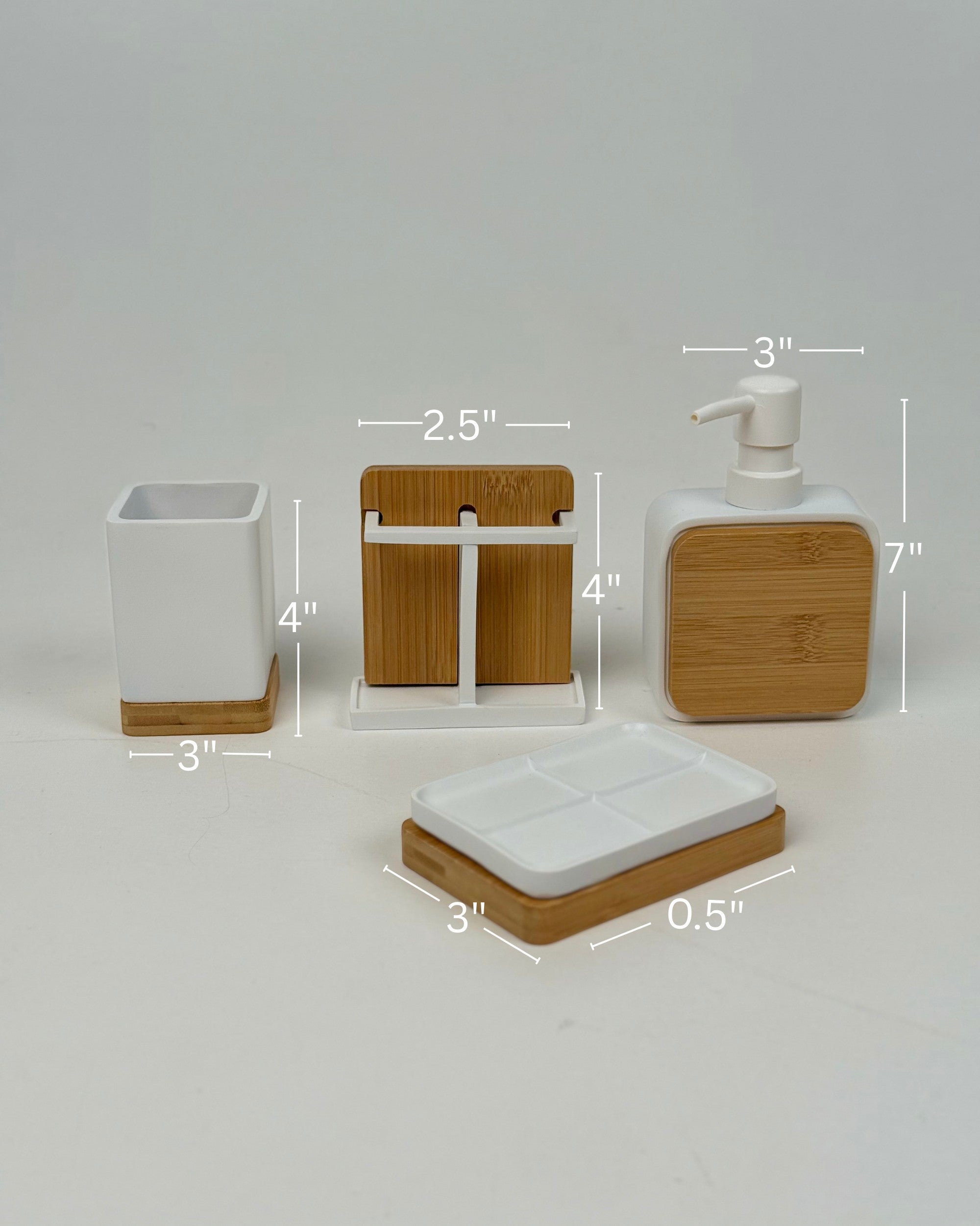 High Objects Zenform Bathroom Essentials Set: white ceramic toothbrush holder, soap dish, and dispenser with bamboo accents.