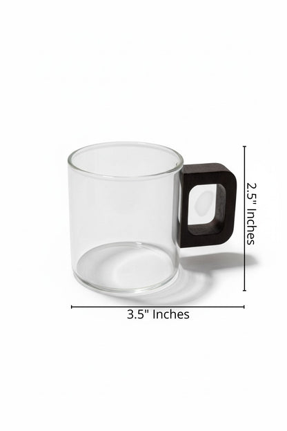 High Objects Aether Arc glass cup with dark square handle. Clear borosilicate glass, 3.5" W x 2.5" H.