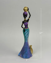 High Objects African Lady Elegance showpiece, 17-inch sculpture of a woman in turquoise, violet, and gold gown holding a pot.