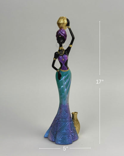 High Objects African Lady Elegance showpiece, 17-inch sculpture of a woman in turquoise, violet, and gold gown holding a pot.