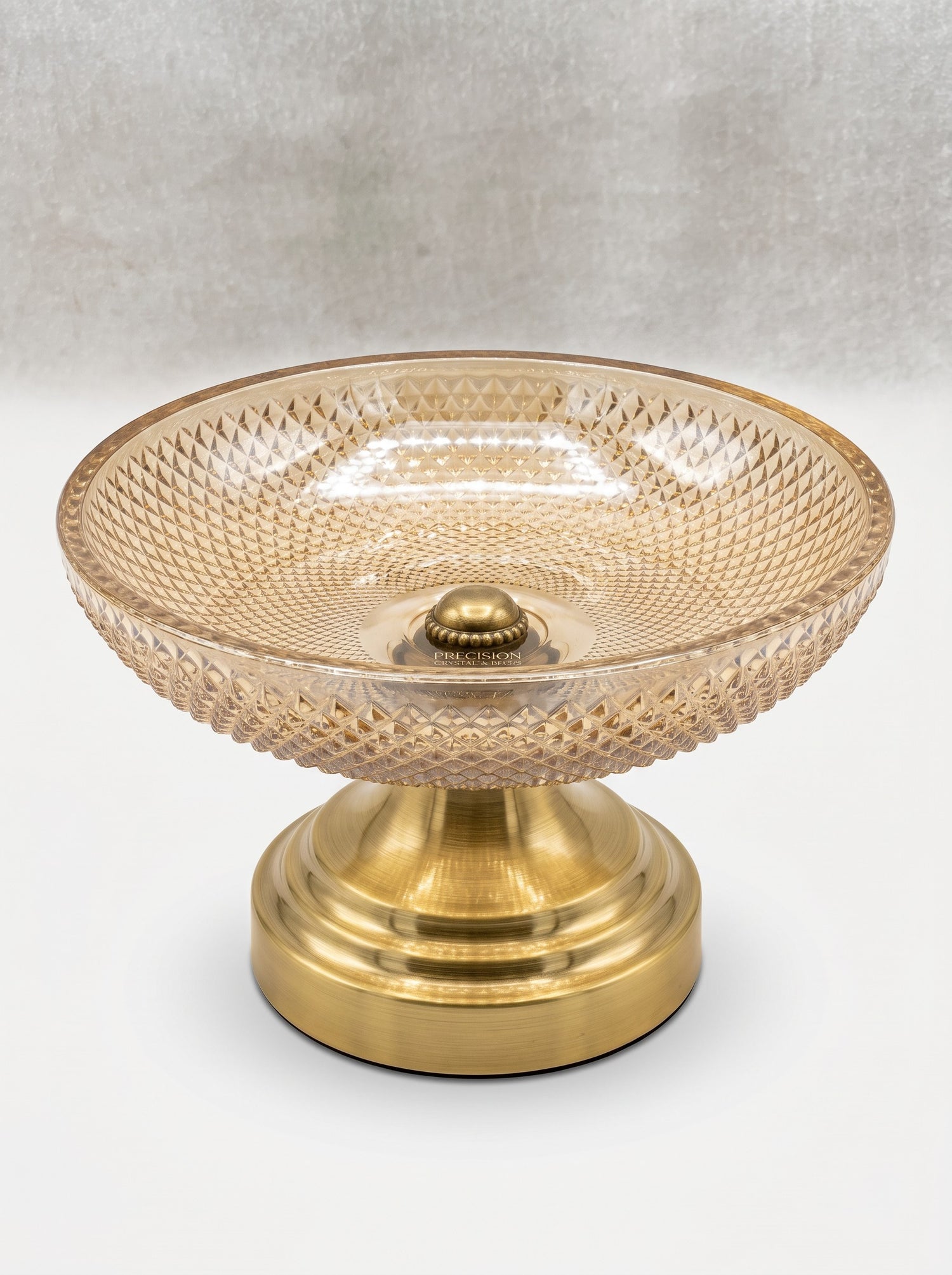 High Objects amber glass bowl with diamond pattern and brass pedestal base