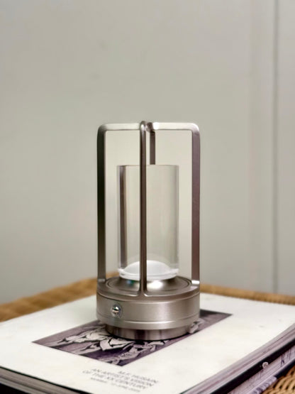 High Objects Aria Frame Table Lamp with brushed metal base and clear glass shade, modern lantern design.