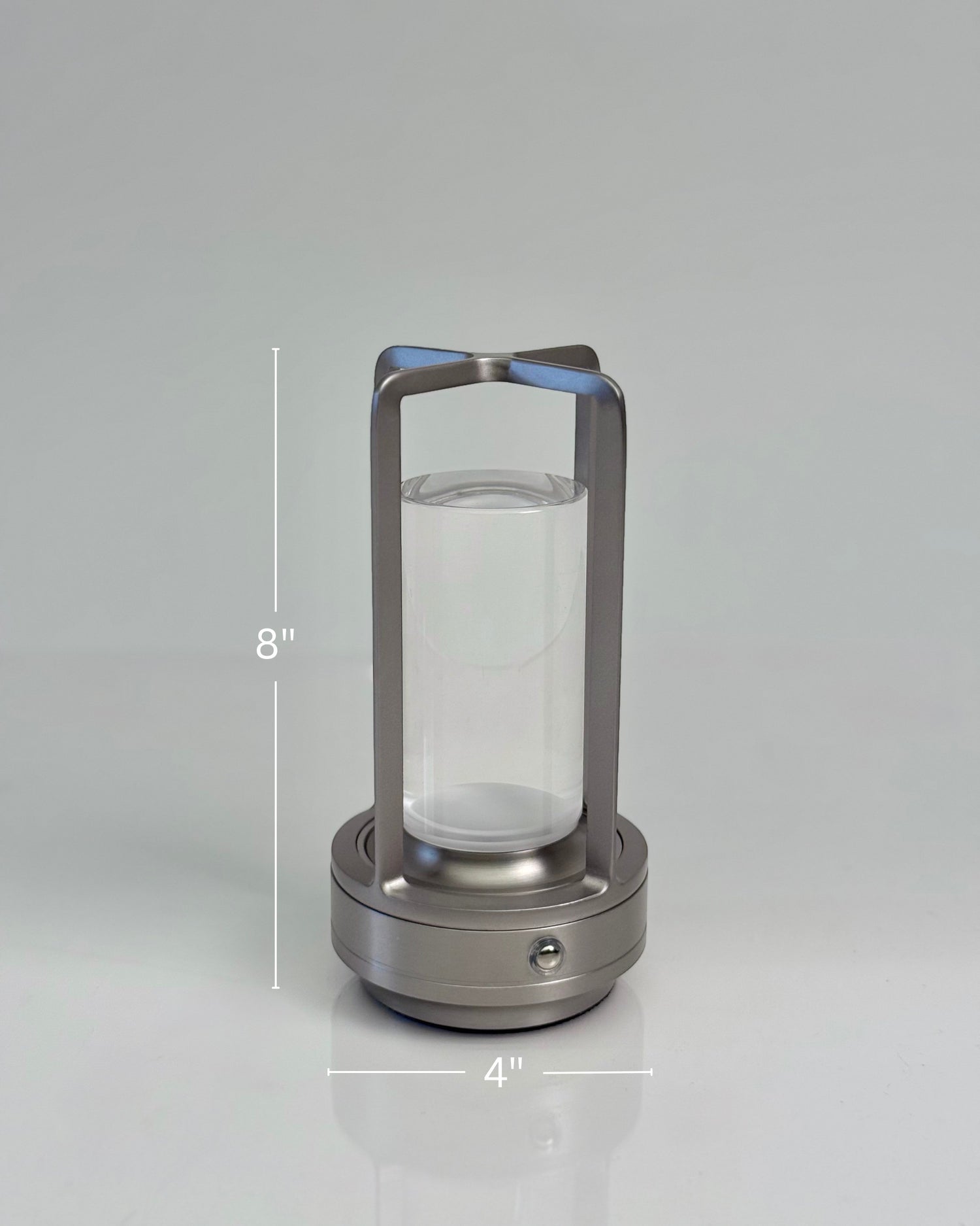 High Objects Aria Frame Table Lamp with brushed metal base, clear glass shade, and frosted diffuser. Modern lantern design.