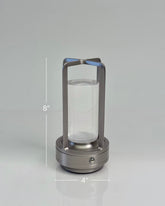 High Objects Aria Frame Table Lamp with brushed metal base, clear glass shade, and frosted diffuser. Modern lantern design.
