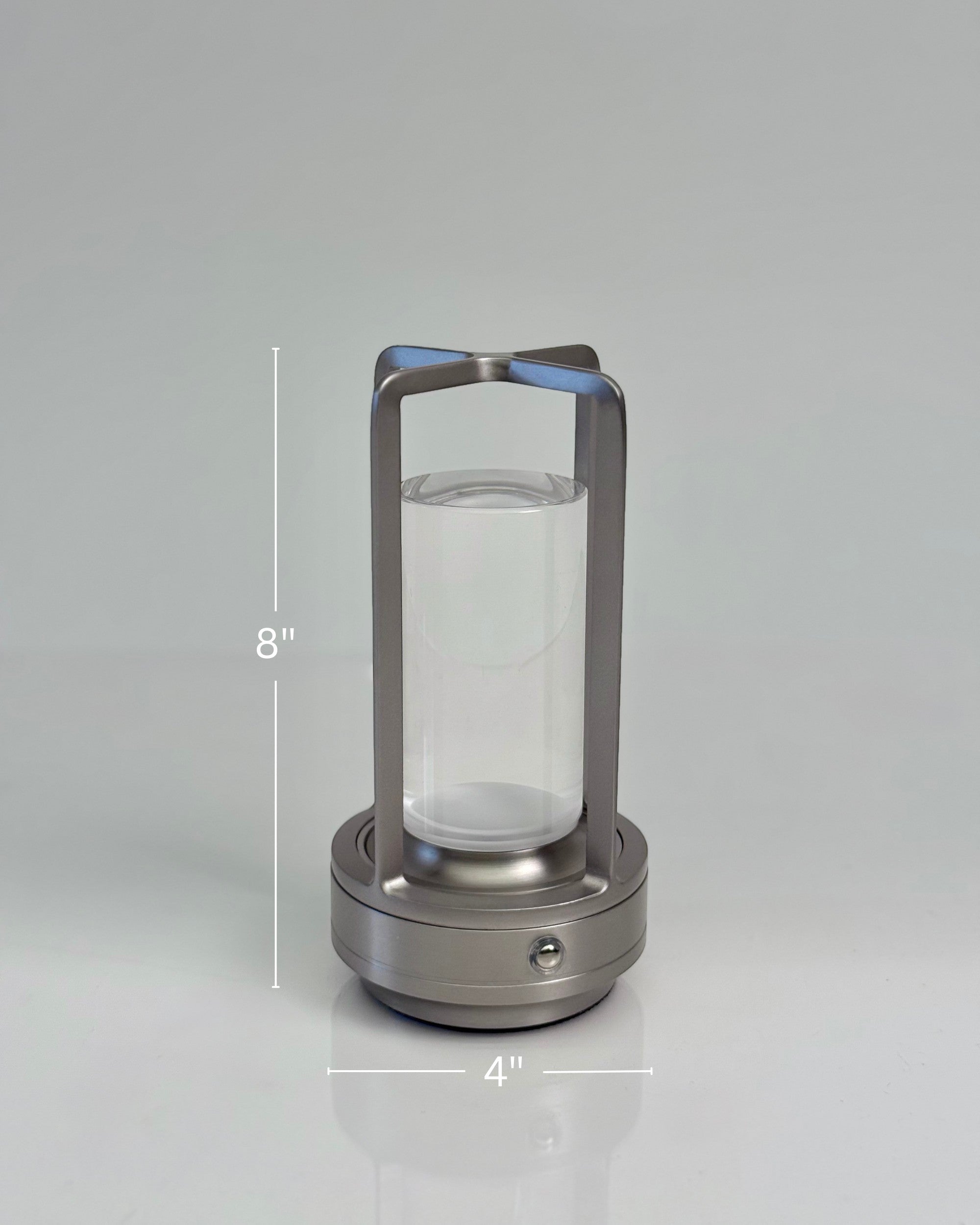 High Objects Aria Frame Table Lamp with brushed metal base, clear glass shade, and frosted diffuser. Modern lantern design.