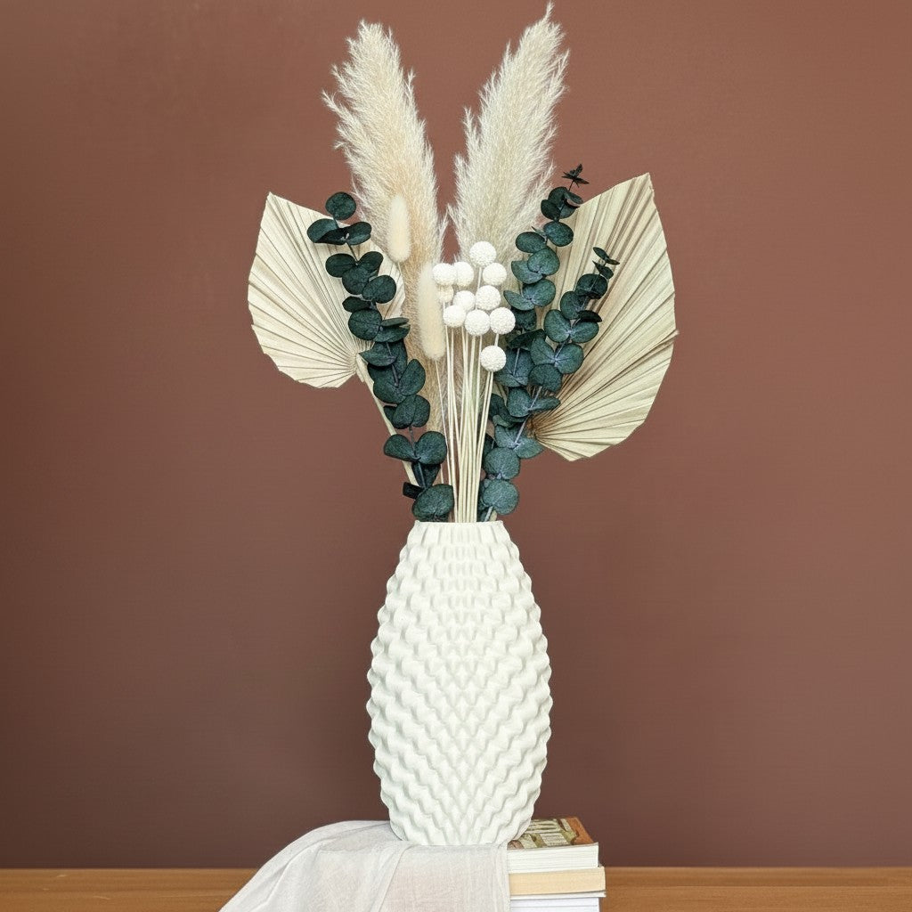 High Objects Arisca Vase in light green ceramic with a textured wave pattern, holding dried botanicals.