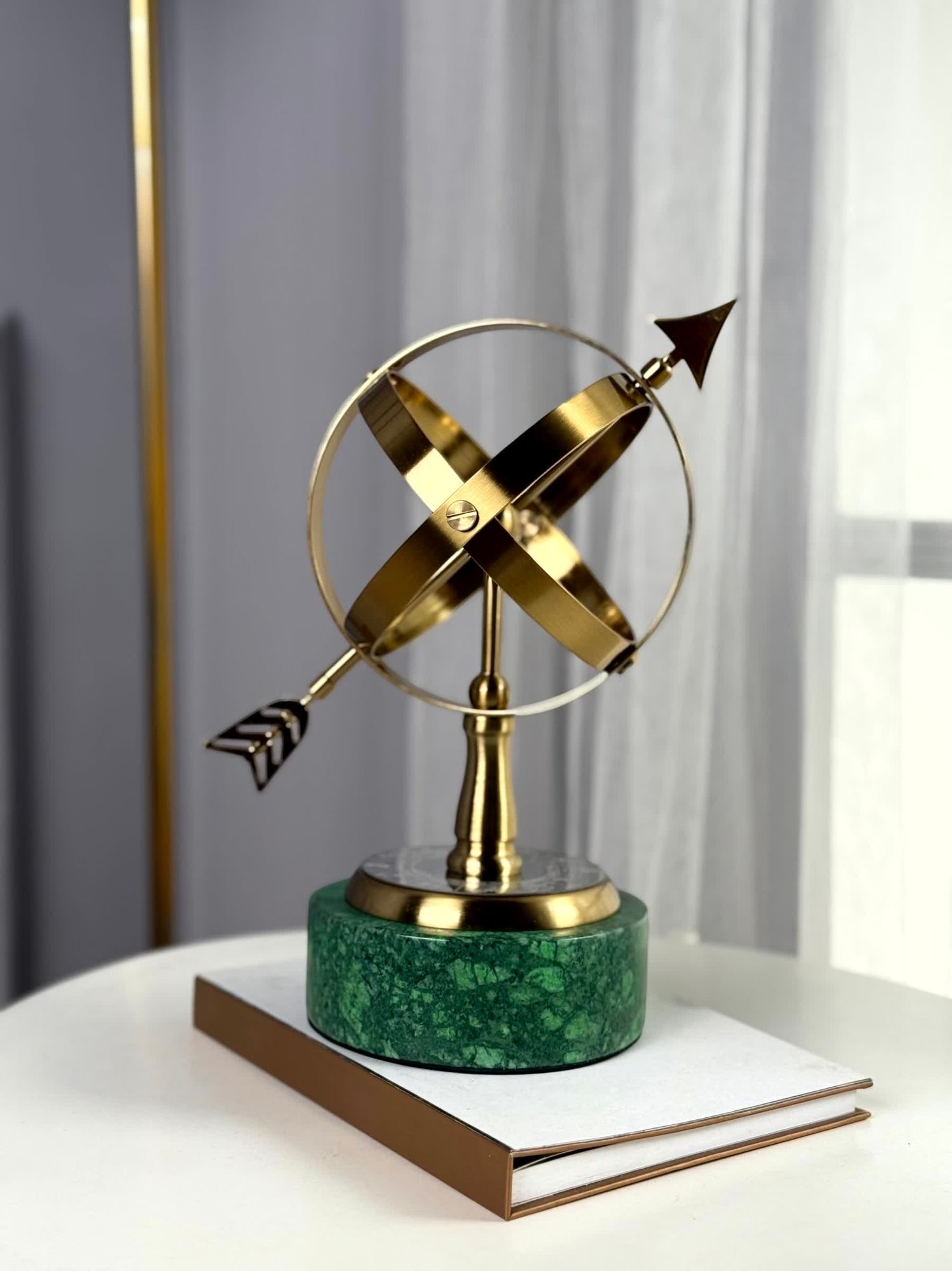 High Objects Armillary Globe Artefact with brass finish globe and arrow on green marble base.