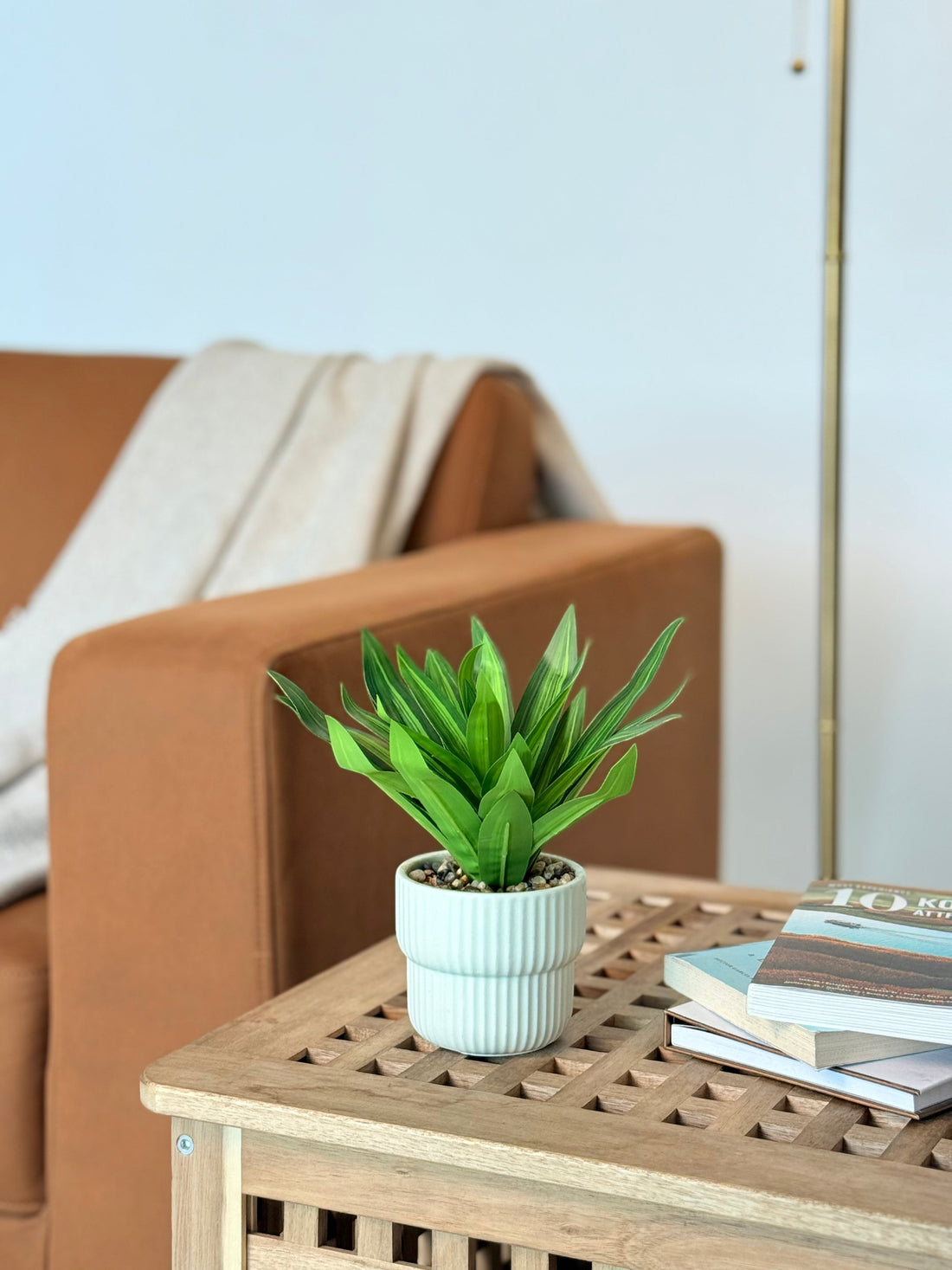 High Objects Artificial Dracaena Lemon Lime Plant in a white ribbed ceramic pot with decorative pebbles.