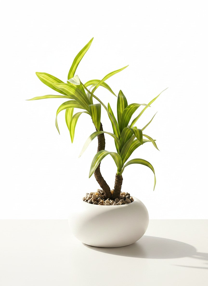 High Objects two-stemmed artificial plant with variegated green leaves in a white ceramic pot with pebbles.