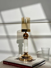 High Objects Aurora Column Candle Stand Set with gold accents, white stone column, and amber glass holder.