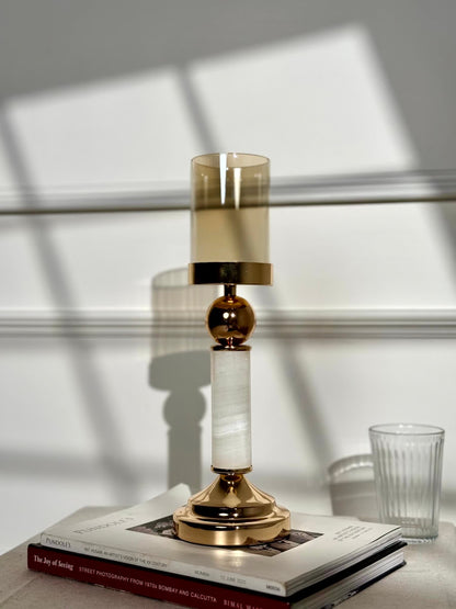 High Objects Aurora Column Candle Stand Set with gold accents, white stone column, and amber glass holder.