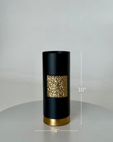 High Objects Aurum Noir matte black cylindrical vase with textured gold band and gold base. 10" H x 4" W.