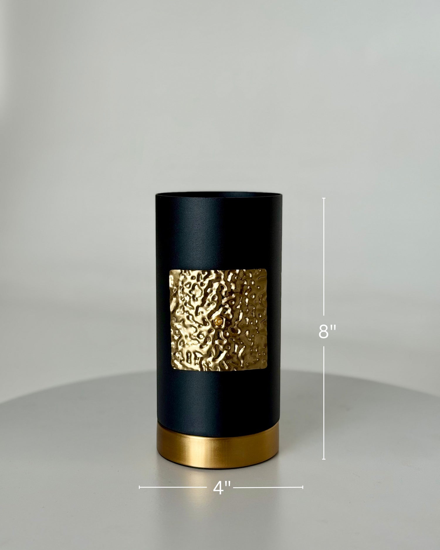 High Objects Aurum Noir matte black cylindrical vase with textured gold band and base, 8" H x 4" W.
