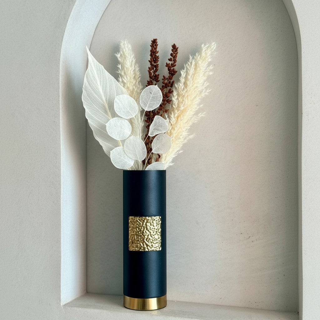 High Objects Aurum Noir matte black cylindrical vase with textured gold band and base, holding dried floral arrangement.