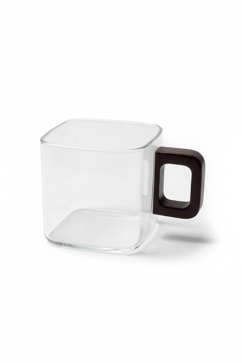 High Objects AXISFORM™ square glass cup with a dark geometric handle, perfect for modern coffee or tea rituals.