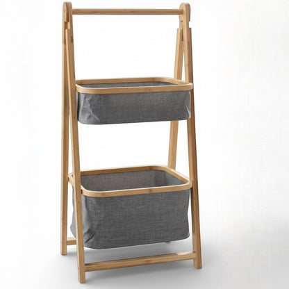 High Objects natural bamboo frame storage organizer with two grey fabric baskets holding towels, books, and plants.