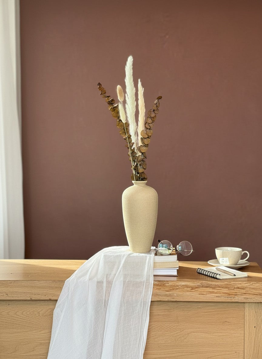 High Objects beige textured ceramic vase with dried pampas grass and eucalyptus stems.