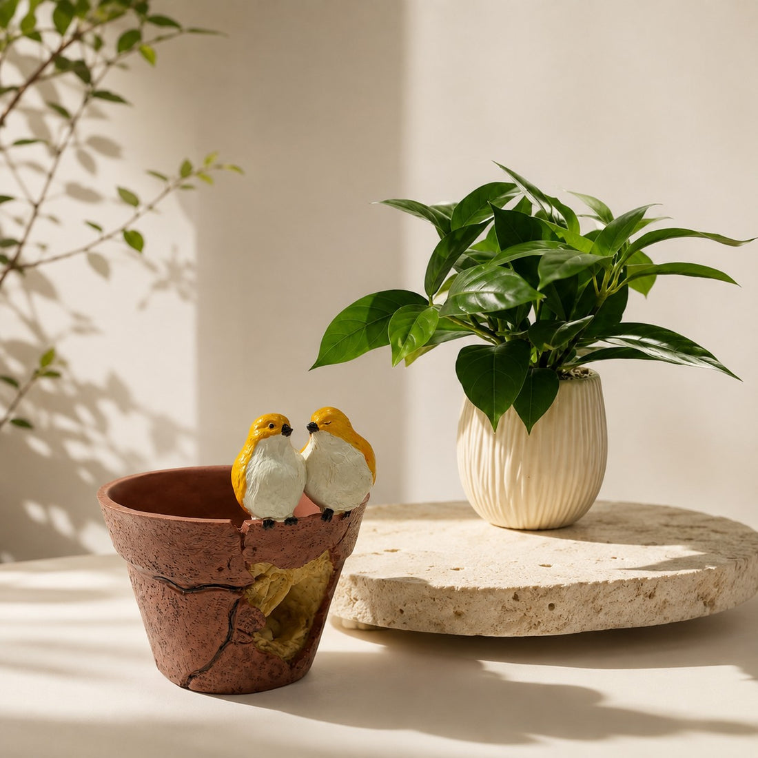 High Objects decorative terracotta-style planter with two yellow bird figurines and a small green plant in a white pot