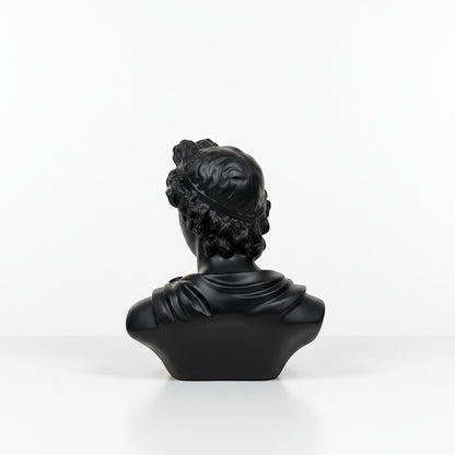 High Objects black matte bust of a classical figure with curly hair and draped clothing, a decorative showpiece.