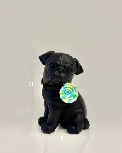 High Objects matte black pug sculpture with a colorful swirl lollipop accent. Modern home decor.