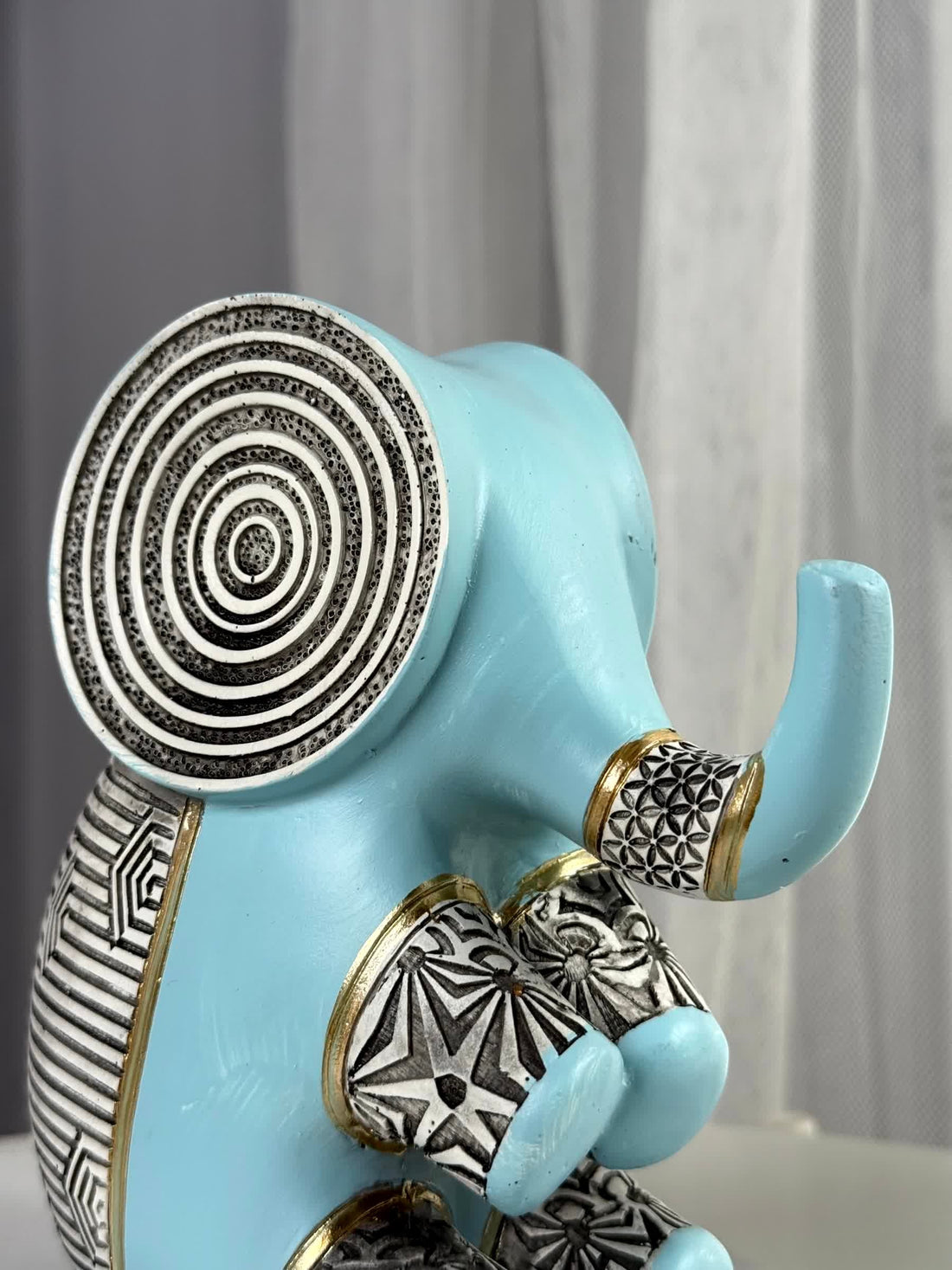 High Objects small blue polyresin elephant figurine with intricate black and white geometric patterns and gold accents.